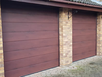 Sectional garage door fitting
